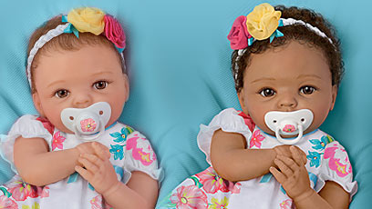 So Truly Mine doll photo gallery: two young girls holding a So Truly Mine baby doll dressed in pink